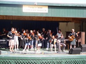 View of Fiddle group from Scotland on stage